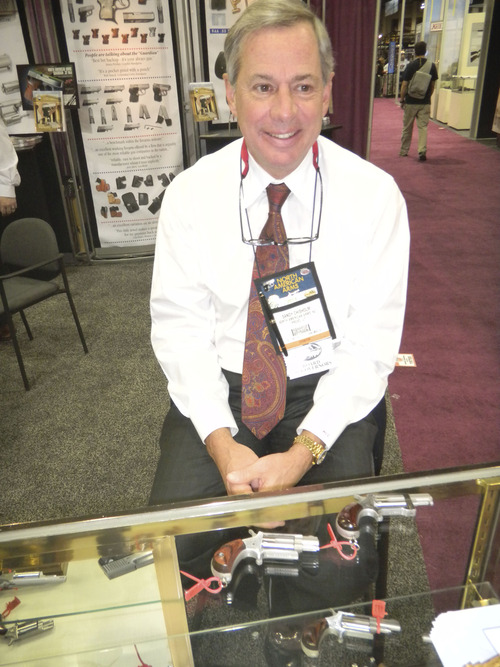 Tom Wharton | The Salt Lake Tribune
Sandy Chisholm, president of North American Arms in Provo, operates his booth at the SHOT Show in Las Vegas on Jan. 17.