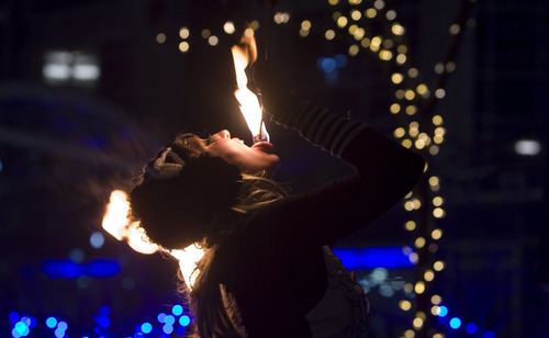 Kim Raff  |  The Salt Lake Tribune
Heidilyn Butterfly of Cirkus Pandemonium eats fire during the second day of EVE at the Gallivan Center in Salt Lake City on December 30, 2012.