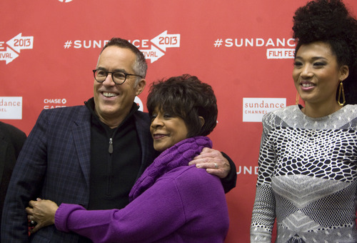 Kim Raff  |  The Salt Lake Tribune
(middle) Merry Clayton hugs festival director (left) John Cooper as (right) Judith Hill looks on while being photographed on the red carpet for the premiere of "Twenty Feet From Stardom" at the Eccles Theatre during opening night of the Sundance Film Festival in Park City on January 17, 2013. The women are singers featured in the film.