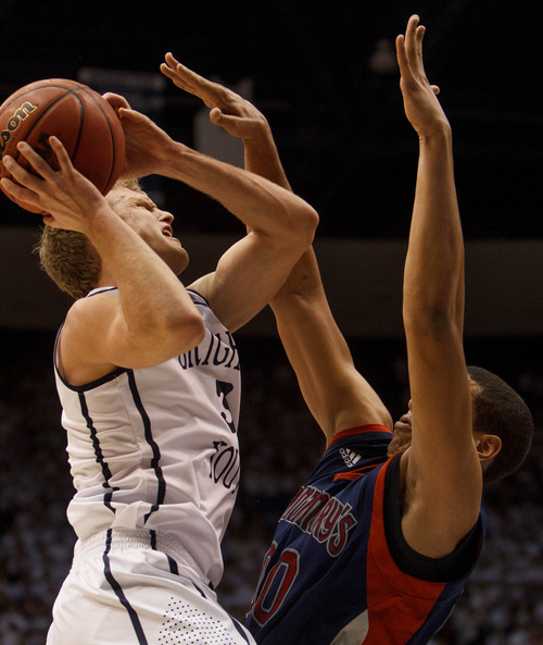 Trent Nelson  |  The Salt Lake Tribune
BYU guard Tyler Haws (3) shoots over Saint Mary's forward Brad Waldow (00) as BYU hosts Saint Mary's, college basketball Wednesday January 16, 2013 in Provo.