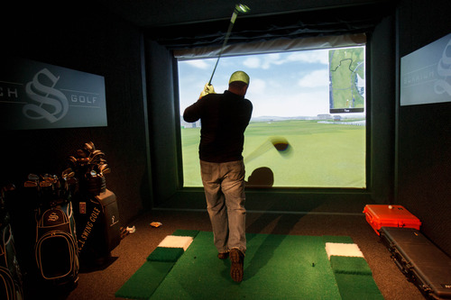 Trent Nelson  |  The Salt Lake Tribune
Greg Marks takes a swing on a golf simulator at the House of Luxury, a $21 million mansion in Deer Valley where high-end brands displayed their products and services during the Sundance Film Festival, Sunday, January 20, 2013.