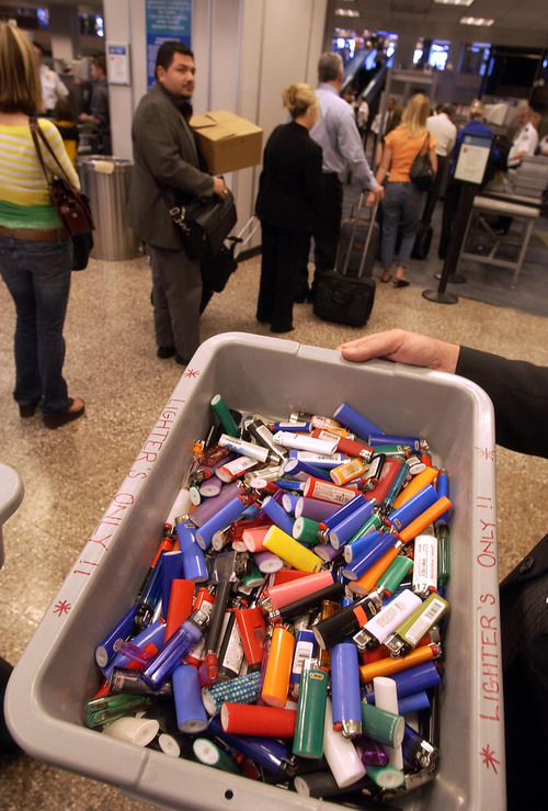 Tribune file photo
A container with some of the hundreds of confiscated lighters at a security checkpoint at Salt Lake City International Airport. Lighters were one of the items dropped from the list of items prohibited on planes by the TSA.