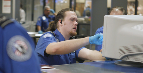 Al Hartmann  |  The Salt Lake Tribune
TSA agents monitor X-ray images of carry on items going through the security checkpoint at Salt Lake City International Airport, Terminal 2, January 15 at 7:30 a.m.