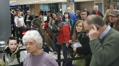 Al Hartmann  |  The Salt Lake Tribune
Fliers que up at the Salt Lake City International Airport, Terminal 2, security checkpoint Tuesday January 15 at 7:30 a.m. a busy time for flight departures.  At first the line looks daunting but it moves quickly with most people getting through security in about 20 minutes.