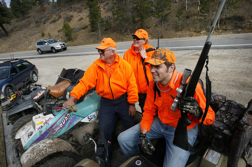 Scott Sommerdorf  |  The Salt Lake Tribune              
Lee Snelgrove, the mayor of Francis, with his son Curtis Snelgrove and daughter Tiffany Snelgrove pause while loading up their off road vehicle near Kamas, Saturday, October 19, 2012. The general season rifle deer hunt opened at dawn Saturday with a new format that limits hunters to one of 30 units instead of one of five regions in the state. More than 52,000 are expected to be in the field.
