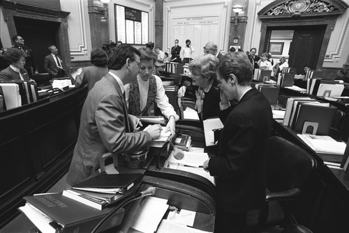 Lawmakers and staff strategize in 1991 as they pass an abortion law that would later be found unconstitutional.| Tribune FIle Photo