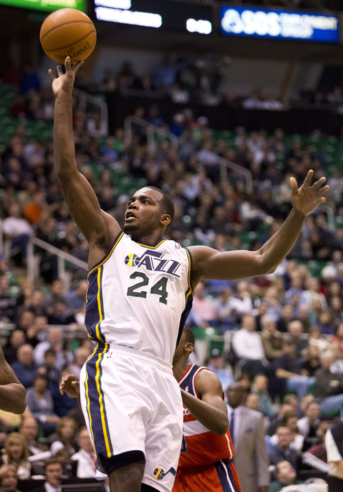 Lennie Mahler  |  The Salt Lake Tribune
Jazz forward Paul Millsap puts up a floater first half of a basketball game against the Washington Wizards at EnergySolutions Arena in Salt Lake City, Utah. Wednesday, Jan. 23, 2013.