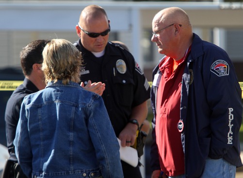 Rick Egan  | The Salt Lake Tribune 

West Valley Police Chief Thayle "Buzz" Nielsen talks to officers at the scene of a fatal shooting at the Lexington Park apartments in West Valley City, after a fatal shooting at the complex, Friday, November 2, 2012.