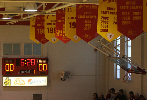 Steve Griffin | The Salt Lake Tribune
Championship banners hang from the rafters in the gym Judge and Davis play basketball at Judge Memorial Catholic High School in Salt Lake City in December.