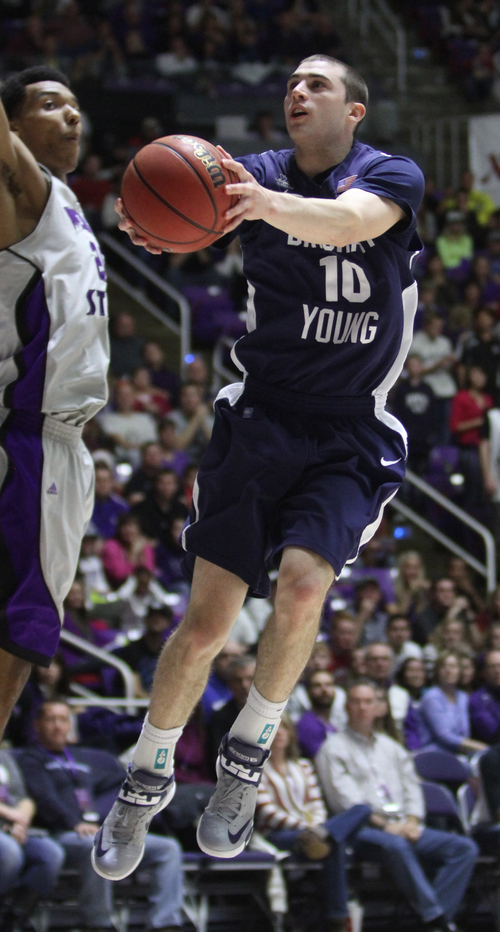 Rick Egan  | The Salt Lake Tribune 

Brigham Young Cougars guard Matt Carlino (10) soars in the air for a shot, in basketball action, BYU vs. Weber State, in Ogden, Saturday, December 15, 2012.