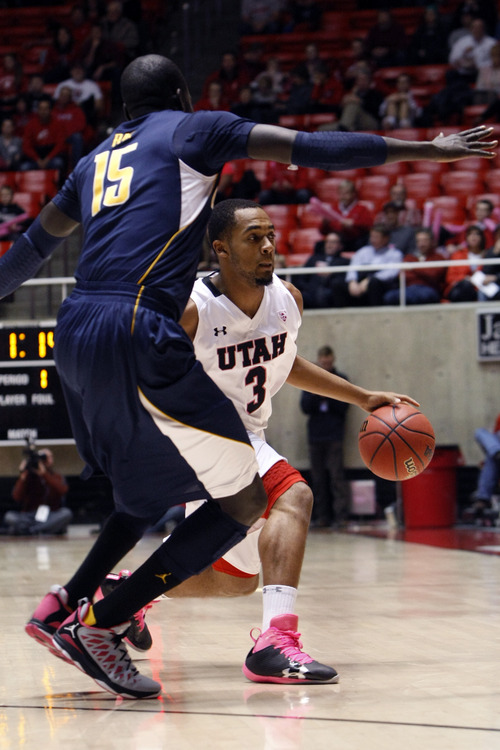 Chris Detrick  |  The Salt Lake Tribune
Utah Utes guard Justin Seymour (3) is guarded by California Golden Bears forward Bak Bak (15) during the first half of the game at the Huntsman Center Thursday January 24, 2013. Cal is winning the game 32-22.