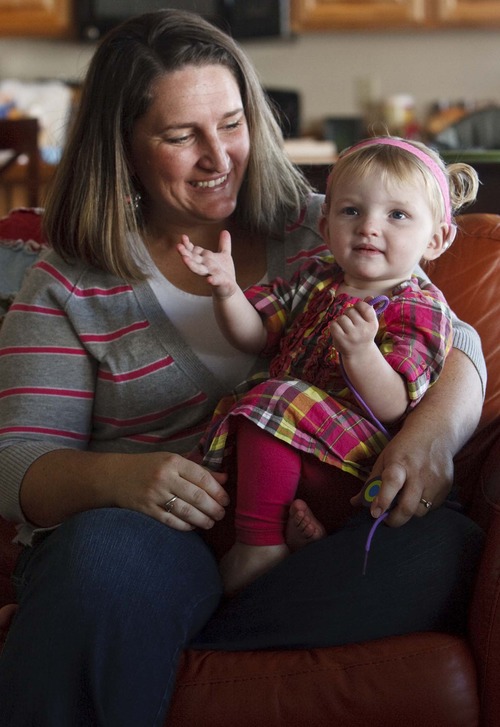Leah Hogsten  |  The Salt Lake Tribune
Sara Doutre with daughter Daisy, 22 months, who became deaf after contracting a virus called cytomegalovirus in utero. Daisy now wears cochlear implants. The Willard mother is now pushing for state legislation that would require pregnant women be told about the virus and taught how to take precautions, along with other actions to raise awareness of CMV.