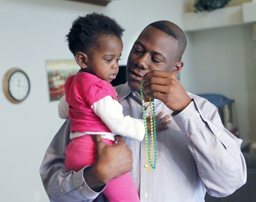 Al Hartmann  |  The Salt Lake Tribune
Terry Achane plays with his 2-year-old daughter, Teleah. Achane was united with his daughter, placed for adoption at birth without his knowledge or consent, on Thursday. A 4th District Court judge made it official during a hearing Friday in Provo.