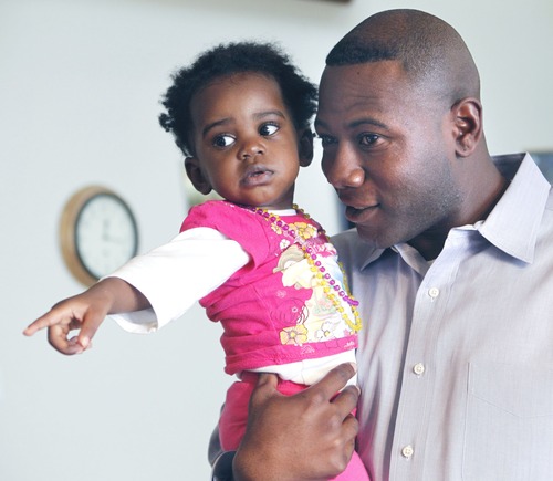Al Hartmann  |  The Salt Lake Tribune
Terry Achane with nearly 2-year-old daughter, Teleah, Friday.  Achane said support of others made it easier to keep fighting for his daughter, who was placed for adoption at birth without his knowledge or consent.