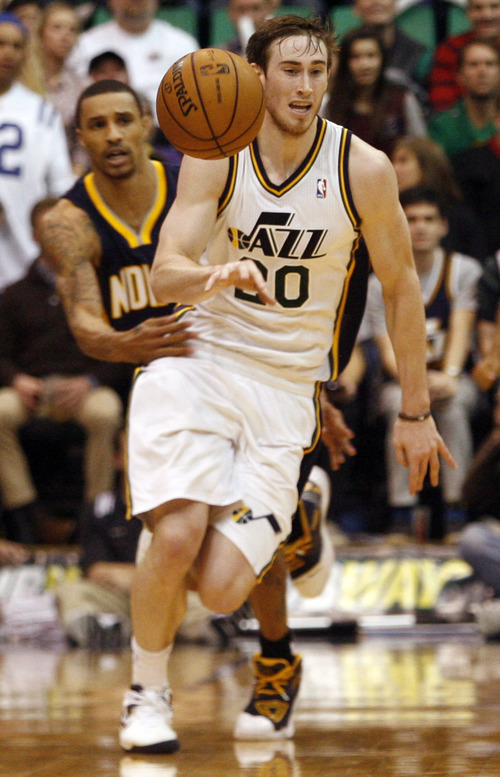 Rick Egan  | The Salt Lake Tribune 

Indiana Pacers point guard George Hill (3) sneaks up to knock the ball out of the hands of Utah Jazz shooting guard Gordon Hayward (20) at the end of regulation, in NBA action, Jazz vs. Indiana game, Saturday, January 26, 2013.