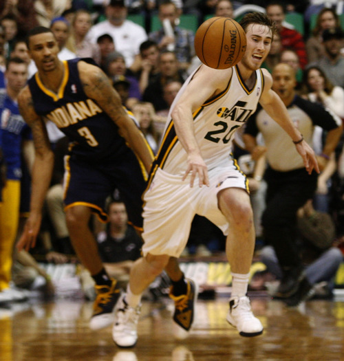Rick Egan  | The Salt Lake Tribune 

Indiana Pacers point guard George Hill (3) sneaks up to knock the ball out of the hands of Utah Jazz shooting guard Gordon Hayward (20) at the end of regulation, in NBA action, Jazz vs. Indiana game, Saturday, January 26, 2013.