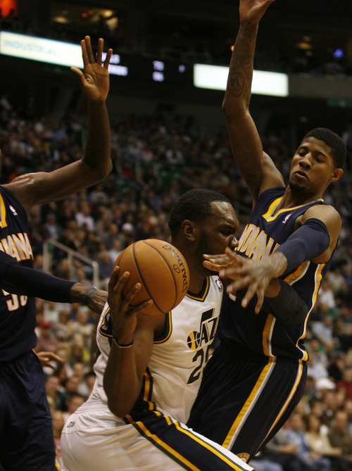 Rick Egan  | The Salt Lake Tribune 

Utah Jazz center Al Jefferson (25) is double teamed by Indiana Pacers center Roy Hibbert (55) and Indiana Pacers small forward Paul George (24), in NBA action, Utah vs. Indiana, Saturday, January 26, 2013.