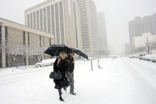 Kim Raff  |  The Salt Lake Tribune
Angela and her son Greg Walz walk down 200 West as heavy snow falls in downtown Salt Lake City on January 27, 2013.