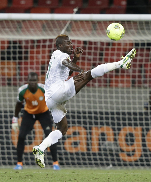 Niger's Dankwa Kofi right, clears the ball as goalkeeper Kassali Daouda looks on, during their African Cup of Nations Group B soccer match against Congo, at Nelson Mandela Bay Stadium in Port Elizabeth, South Africa, Thursday, Jan. 24, 2013. (AP Photo/Rebecca Blackwell)