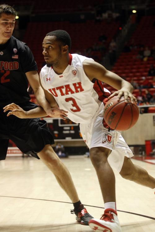 Ashley Detrick  |  The Salt Lake Tribune
Utah Utes guard Justin Seymour (3) drives to the basket during the game against Stanford at Utah Sunday January 27, 2013. Utes were trailing the Cardinals at half, 46-26.
