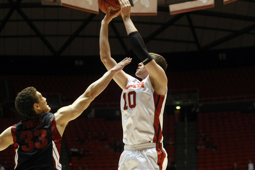 Ashley Detrick  |  The Salt Lake Tribune
Utah Utes forward Renan Lenz shoots a basket as Stanford Cardinal forward Dwight Powell tries to block it during the game against Stanford at Utah Sunday January 27, 2013. Utes were trailing the Cardinals at half, 46-26.