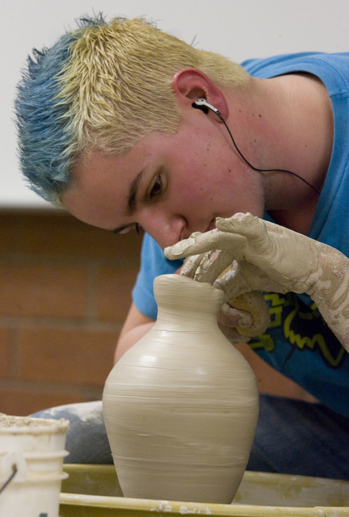 Rick Egan  | The Salt Lake Tribune 
Spencer M. Reed, Cyprus, works on a pot at Taylorsville High, Monday, January 28, 2013. More than 50 top student artists from Granite District High Schools created works on-site during "Art Night Live!" at Taylorsville High.