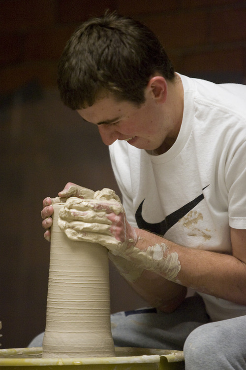 Rick Egan  | The Salt Lake Tribune 

Paxon Hightower,  Hunter,works on a pot at Taylorsville High, Monday, January 28, 2013. More than 50 top student artists from Granite District High Schools created works on-site during "Art Night Live!" at Taylorsville High.