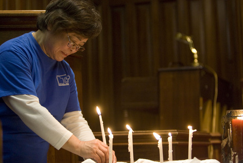 Kim Raff  |  The Salt Lake Tribune
Tomoko Moses lights a candle in remembrance of those touched by nuclear testing during the Utah Campaign to Abolish Nuclear Weapons second annual day of remembrance for downwinders at Skaggs Memorial Chapel at First Baptist Church in Salt Lake City on January 27, 2013.