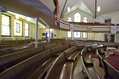 Paul Fraughton  |  The Salt Lake Tribune
An interior view of the main chapel at Salt Lake City's First United Methodist Church on the corner of 200 South and 200 East. The pews form a kind of semicircle, with a balcony above. Every seat boasts a clear view of the altar.