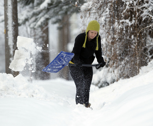 Al Hartmann  |  The Salt Lake Tribune
Megan Kelly shovels out her sidewalk along 2700 South in Sugarhouse Monday morning January 28 after yesterday's storm.