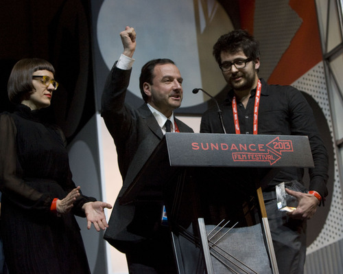 Kim Raff  |  The Salt Lake Tribune
(middle) Director Mike Lerner celebrates winning A World Cinema Documentary Special Jury Award for Punk Spirit for his film "Pussy Riot-A Punk Prayer" during the Sundance Film Festival awards ceremony at Snyderville Basin Fieldhouse Recreation Center in Park City on January 26, 2013.
