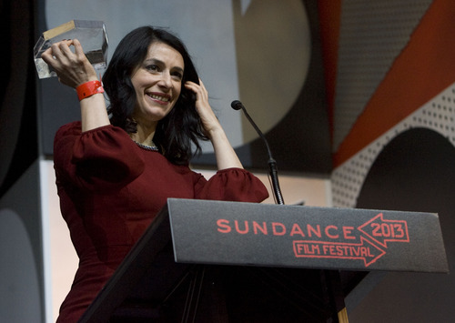 Kim Raff  |  The Salt Lake Tribune
Director Tinatin Gurchiani accepts the Directing Award: World Cinema Documentary for her film "The Machine Which Makes Everything Disappear" during the Sundance Film Festival Awards Ceremony at Snyderville Basin Fieldhouse Recreation Center in Park City on January 26, 2013.