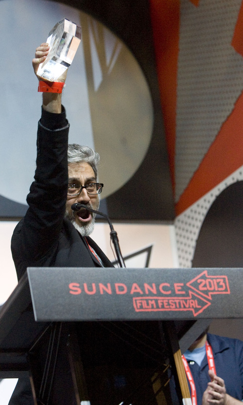 Kim Raff  |  The Salt Lake Tribune
Director and screenwriter Barmak Akram celebrates receiving the Screenwriting Award: World Cinema Dramatic for his film "Wajma (An Afghan Love Story)" during the Sundance Film Festival Awards Ceremony at Snyderville Basin Fieldhouse Recreation Center in Park City on January 26, 2013.