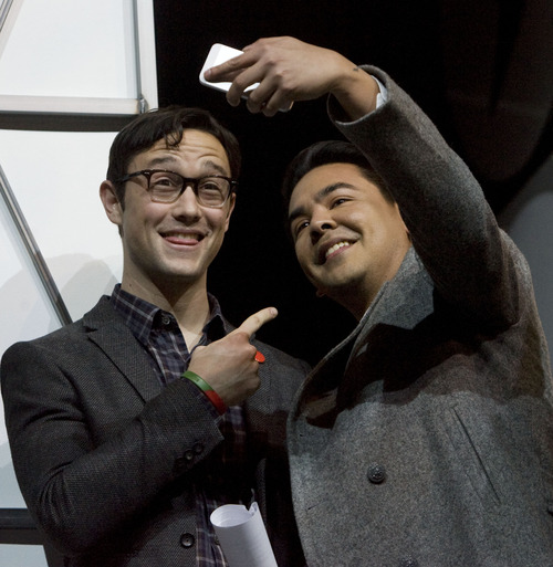 Kim Raff  |  The Salt Lake Tribune
Joseph Gordon-Levitt hosts the Sundance Film Festival Awards Ceremony takes a picture with an award winner on the stage during the ceremony at the Snyderville Basin Fieldhouse Recreation Center in Park City on January 26, 2013.