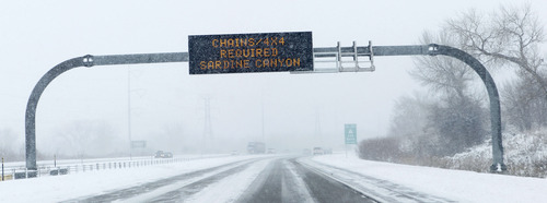 Al Hartmann  |  The Salt Lake Tribune
A sign on I-15 before Brigham City warns drivers of restrictions in Sardine Canyon Tuesday January 29 during the second installment of a major winter snowstorm to hit northern Utah.