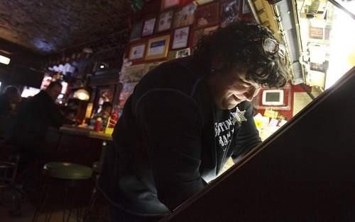 Leah Hogsten  |  The Salt Lake Tribune
Leslie Sutter, owner of The Shooting Star Saloon, fixes the saloon's juke box that plays 45s from the 1940s to the 1970s. The Shooting Star Saloon is Utah's oldest bar, built in 1865 as a trading post, it was converted into a bar in 1879.