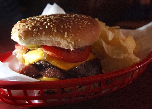Leah Hogsten  |  The Salt Lake Tribune
The Star Burger is a double patty hamburger with a split knackwurst.