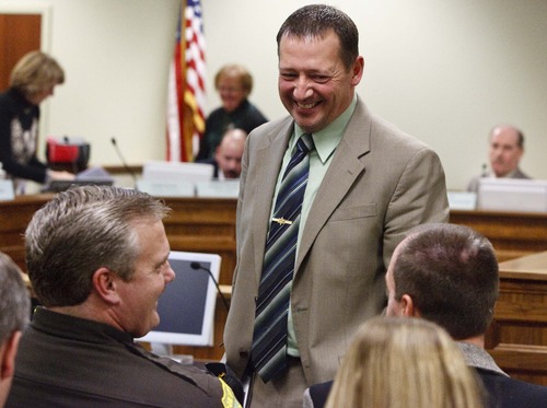 Leah Hogsten  |  The Salt Lake Tribune
Utah Rep. Paul Ray shares a laugh with members of the Utah Sheriffs' Association, which recently sent a controversial letter to President Barack Obama saying Utah law enforcement officials would lay down their lives to protect the Constitution. At the request of Rep. Curt Oda, Millard County Sheriff Robert Dekker read the letter to the House Law Enforcement and Criminal Justice Committee of the Legislature at the State Capitol Complex House Building, Tuesday January 29, 2013.