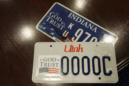 Francisco Kjolseth  |  The Salt Lake Tribune
America's Freedom Festival, partners with State Senator Todd Weiler and State Representative Val Peterson to sponsor what could be Utah's first "In God We Trust" license plate. Gov. Gary Herbert's deputy chief of staff, Mike Mower was joined by his nephew, 11-year-old Tate Christensen who had the idea after wondering why Utah didn't have one. Senator Weiler and Representative Peterson are sponsoring legislation to get the plate approved, and the Freedom Festival at Provo is organizing the effort. State law requires that 500 Utahns pre-order a new license plate before it becomes available to the public which could be after the 2013 legislative session.