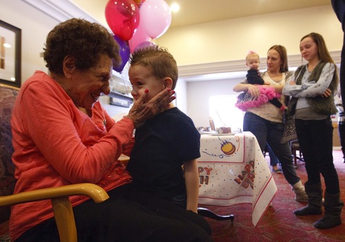 Leah Hogsten  |  The Salt Lake Tribune
Mildred Del'Andrae greets her great-grandson Weston Parker, 4, while celebrating her 102nd birthday with friends and family at the senior living community where she lives. Parker's mother, Heidi, and sisters Sage, 10 months, and Alexis, 11, are at right.