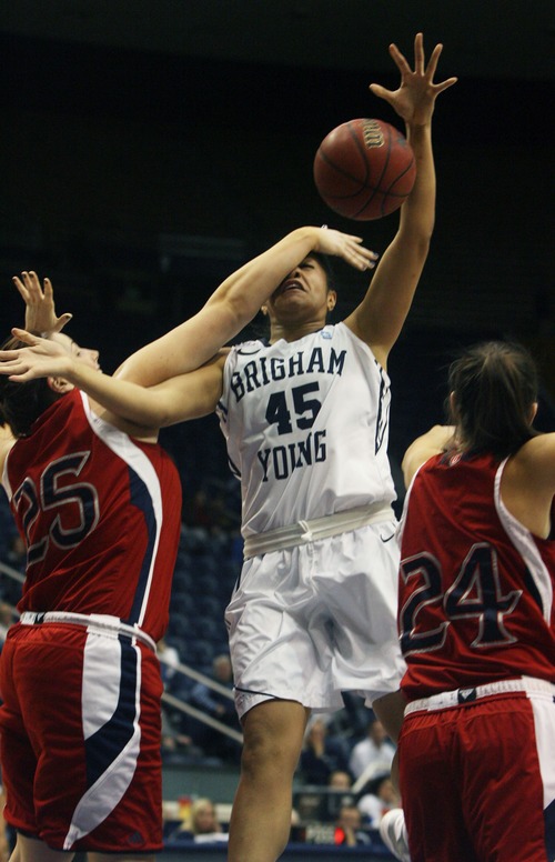 Kim Raff  |  The Salt Lake Tribune
BYU player (middle) Keilani Unga tries for a basket but is stopped by St. Mary's players (left) Carli Rosenthal and Morgan Hatten during a game at the Marriott Center in Provo on January 31, 2013.