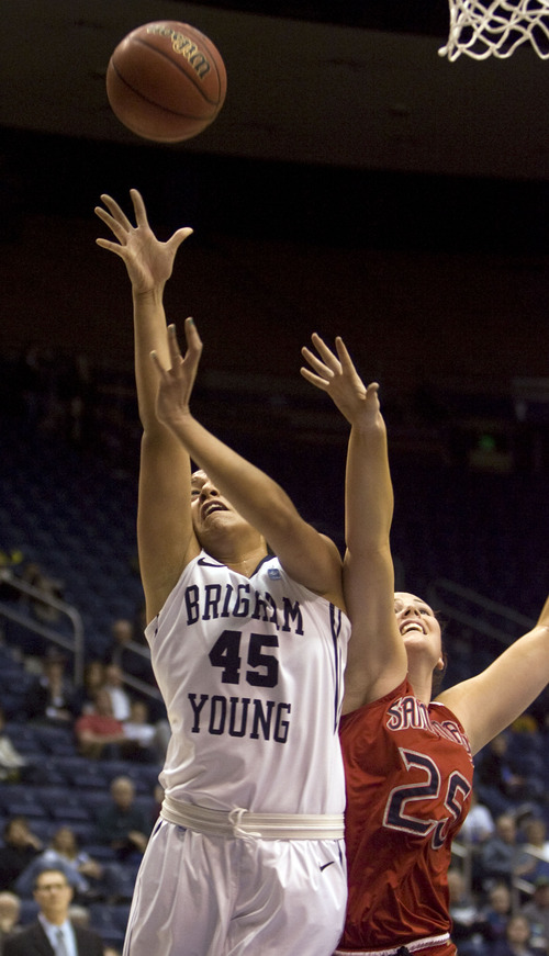 Kim Raff  |  The Salt Lake Tribune
BYU player (left) Keilani Unga takes a shot as St. Mary's player (right) Carli Rosenthal defends during a game at the Marriott Center in Provo on January 31, 2013.