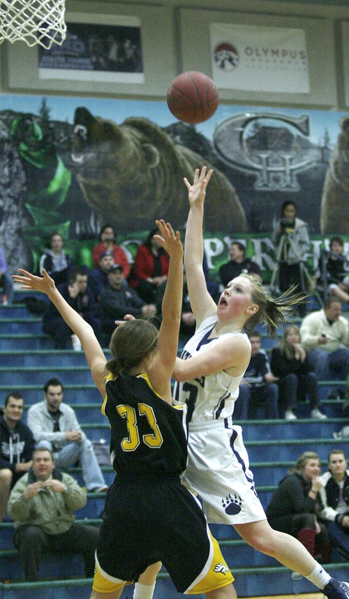Paul Fraughton  |   Salt Lake Tribune
Copper Hills' Candace Goodwin  shoots over the arms of Cottonwood's Rebeca Bromley-Dulfano.
 Thursday, January 31, 2013