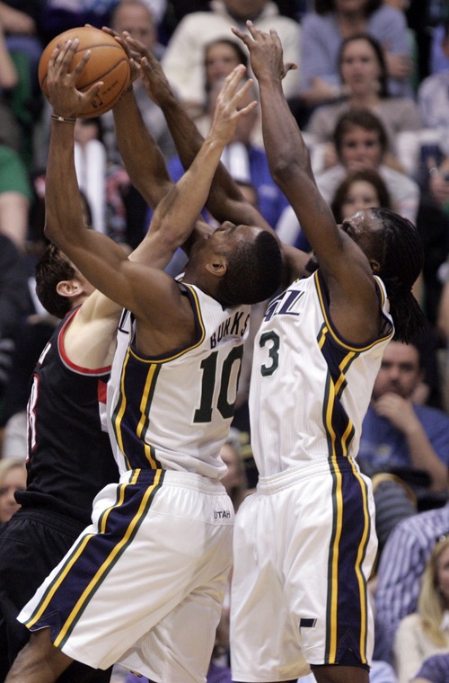 Kim Raff  |  The Salt Lake Tribune
Utah Jazz point guard (middle) Alec Burks (10) and Utah Jazz small forward DeMarre Carroll (3) compete with (left) Portland Trail Blazers small forward Victor Claver (18) for a rebound during the second half at EnergySolutions Arena in Salt Lake City on February 1, 2013.