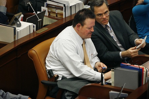 Scott Sommerdorf  |  The Salt Lake Tribune
Rep. Carl Wimmer, R-Herriman, openly wears his sidearm at his desk in the Utah House of Representatives on the final night of the session. Wimmer was the sponsor of HB129, which would have allowed any adult without a criminal history to carry a concealed weapon without a permit. The bill failed.