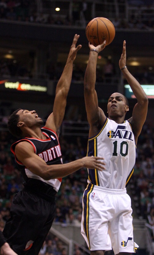 Kim Raff  |  The Salt Lake Tribune
(right) Utah Jazz point guard Alec Burks (10) shoots the ball as (left) Portland Trail Blazers point guard Ronnie Price (24) defends during the second half at EnergySolutions Arena in Salt Lake City on February 1, 2013.  The Jazz went on to win the game 86-77.