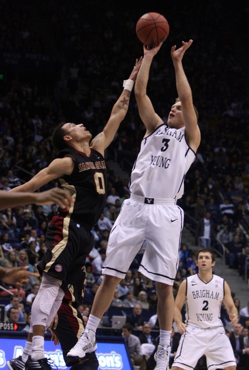 Kim Raff  |  The Salt Lake Tribune
(right) Brigham Young Cougars guard Tyler Haws (3) shoots the ball past Santa Clara Broncos guard Evan Roquemore (0) during a game at the Marriott Center in Provo on February 2, 2013.