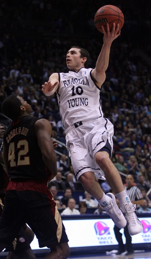 Kim Raff  |  The Salt Lake Tribune
(right) Brigham Young Cougars guard Matt Carlino (10) shoots the ball as Santa Clara Broncos guard Raymond Cowels III (42) defends during a game at the Marriott Center in Provo on February 2, 2013.