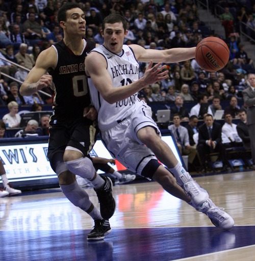 Kim Raff  |  The Salt Lake Tribune
(right) Brigham Young Cougars guard Matt Carlino (10) drives the basekt as Santa Clara Broncos guard Evan Roquemore (0) defends during a game at the Marriott Center in Provo on February 2, 2013.