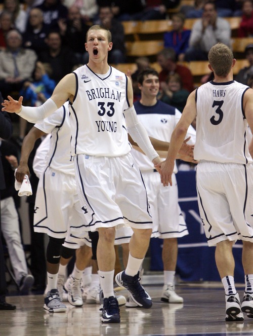 Kim Raff  |  The Salt Lake Tribune
Brigham Young Cougars forward Nate Austin (33) celebrates with his team during a time out during a game against the Santa Clara Broncos at the Marriott Center in Provo on February 2, 2013.